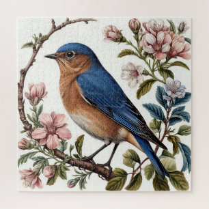 Blaumeise sitzt zwischen blühenden Blumen