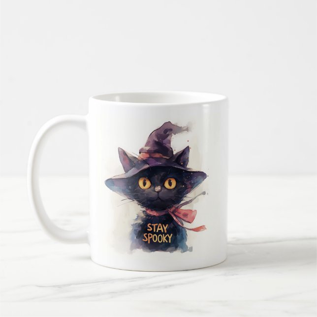 Bleibe Spooky - Schwarze Wasserfarbe in Hexenhut Kaffeetasse (Links)
