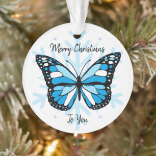 Bleu papillon sur un flocon de neige Noël