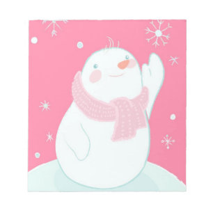Bloc-note Un bonhomme de neige atteignant pour un flocon de