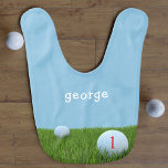 Blue and Green First Birthday Funny Golf Niedlich  Babylätzchen<br><div class="desc">Geeignet für alle zukünftigen Golfer und Väter,  die treiben. Golfbälle auf dem Grün,  mit einer Zahl,  die zu sehen ist. Das Ziel ist es,  diese Tropfsteine zu erwischen,  den Namen Ihres kleinen Golfers hinzuzufügen.</div>