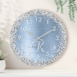 Blue Brushed Metal Silver Glitter Monogram Name Runde Wanduhr<br><div class="desc">Easily personalize this trendy chic wall clock design featuring pretty silver sparkling glitter on a blue brushed metallic background.</div>