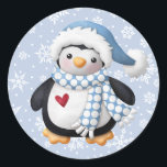 Blue Christmas Penguin Round Sticker<br><div class="desc">Mit diesem niedlichen, klassischen Rundaufkleber feiern Sie Weihnachtsjubeljubiläum und feiern die festliche Jahreszeit mit einer hübschen Illustration eines Weihnachtspinguins mit einem kleinen roten Herz auf der Brust, einem blauen und weißen Weihnachtshut und einem blauen Punktschal, einem Set auf einem blauen Hintergrund mit weißen Schneeflocken. Es ist eine einfache Möglichkeit, die...</div>