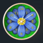 Blue Daisy Blume auf Green Beautiful Wanduhr<br><div class="desc">Diese hübsche Blumenuhr hat eine originelle, stilisierte Blume, in einem gedämpften Stil und farbenfroh blau. Die gelb-orangefarbenen Uhrennummern markieren die Zeit auf den zwölf Blättern. Der Hintergrund ist in einem abstrakten grün mit Motiven und ähnelt einem Gras. Dies ist eine helle, mutige Uhr für einen Gärtner oder jeden Liebhaber von...</div>