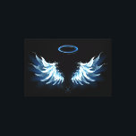 Blue Glowing Angel Wings on black background Leinwanddruck<br><div class="desc">Light,  artistic,  blue angel wings on a black background. Angel wings.</div>
