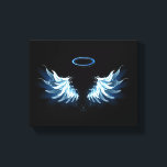 Blue Glows Angel Wings auf schwarzem Hintergrund Leinwanddruck<br><div class="desc">Helle,  künstlerische,  blaue Engelsflügel auf schwarzem Hintergrund. Engel Flügel.</div>