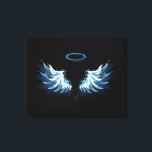 Blue Glows Angel Wings auf schwarzem Hintergrund Leinwanddruck<br><div class="desc">Helle,  künstlerische,  blaue Engelsflügel auf schwarzem Hintergrund. Engel Flügel.</div>