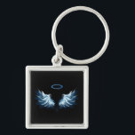 Blue Glows Angel Wings auf schwarzem Hintergrund Schlüsselanhänger<br><div class="desc">Helle,  künstlerische,  blaue Engelsflügel auf schwarzem Hintergrund. Engel Flügel.</div>