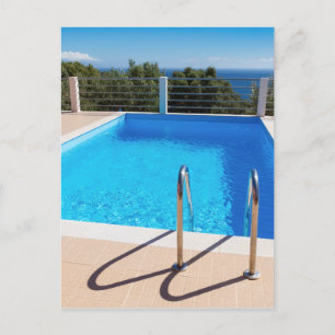 Blue Swimming pool with steps at sea Postkarte