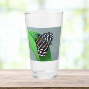 Blue Wave Butterfly auf dem Leaf Foto Glas