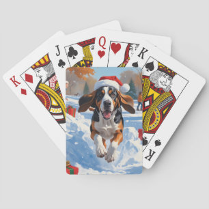 Bluetick Coonhound läuft im Schnee mit Weihnachten Spielkarten