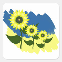 Blühende Sonnenblumen und ukrainische Flagge.