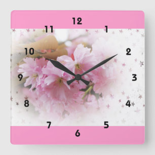 Blume aus Rosa Kirsche. Blumenkunst aus Foto. Quadratische Wanduhr