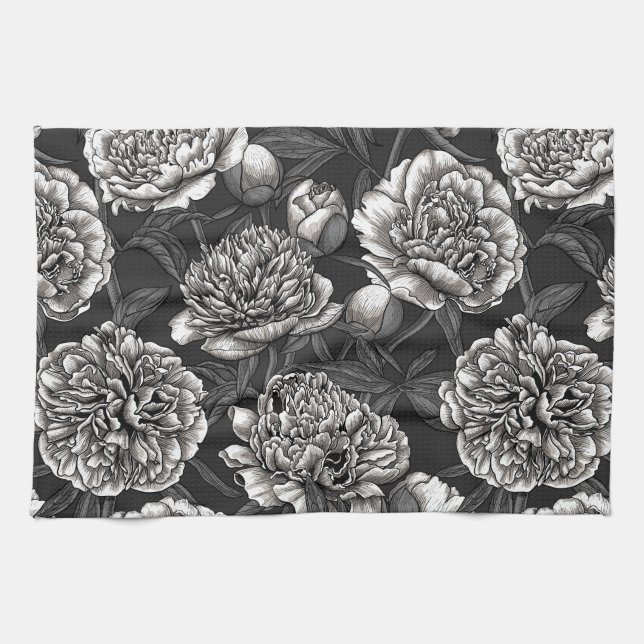 Blume aus weißem Pfirsich auf dunkelgrau Geschirrtuch (Horizontal)