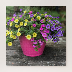 Blumenkübel mit rosa und gelben Blumen als Puzzle