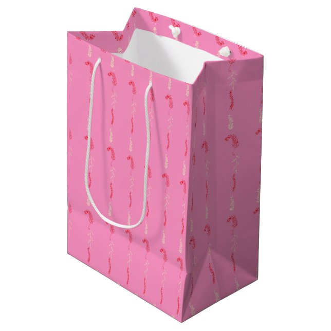 Blumenschrift auf rosa mittlere geschenktüte (Vorderseite Schrägansicht)