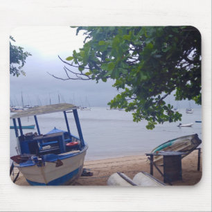 Boats stopped at the beach on a rainy day mousepad