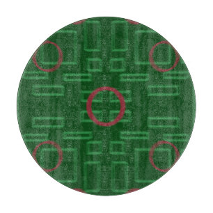 Boîtes géométriques sur la planche à découper vert