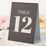 Bold Basic Brown Modern Reception Table Number Tischaufsteller<br><div class="desc">This wedding table tent in brown features bold, modern typography on a rich neutral background for clear, at-a-glance table identification. The folded, self-standing format sits neatly on reception tables and works well for weddings, rehearsal dinners, and formal celebrations. A simple, polished choice that pairs easily with modern stationery, signage, and...</div>