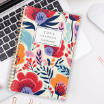 Bold Red Orange Floral Pattern Personalisiert 2025 Planer<br><div class="desc">Personalisieren Sie diesen Planer mit Ihrem Namen in schwarz kursiv gerahmt durch ein weißes Rechteck,  auf einem fett,  farbenfrohen Muster von roten,  orangefarbenen und violetten Blumen auf einem beigen Hintergrund.</div>