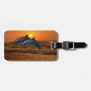 Bottlenose Dolphin bei Sonnenuntergang Gepäckanhänger
