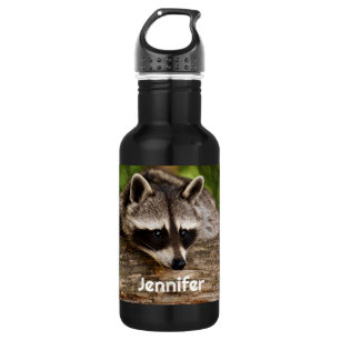 Bouteille D'eau Raccoon mignon reposant sur un journal