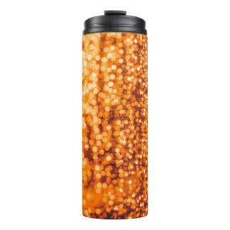 Bouteilles Isothermes Des gouttes orange sur verre, arrière - plan abstr