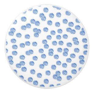 Bouton en céramique avec le pois bleu