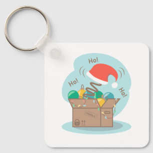 Boxbox mit Weihnachtsdekoration und Weihnachtsmann Schlüsselanhänger