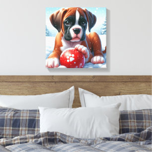 Boxer-Welpe spielt im Schnee mit einem roten Spiel Leinwanddruck