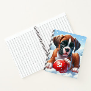 Boxerpuppchen mit rotem Ball im Winter Notizbuch