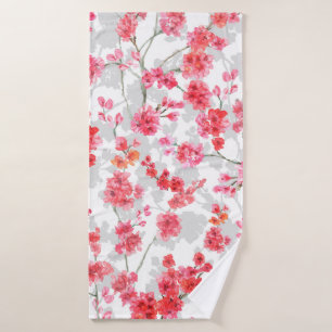 Branches de fleurs de cerisiers sur le fond blanc 