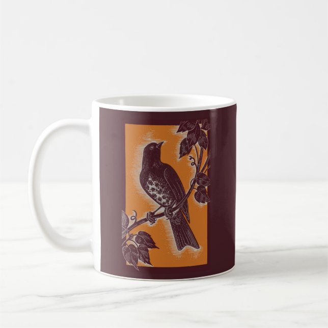 Braundrossel mit Orange Kaffeetasse (Links)