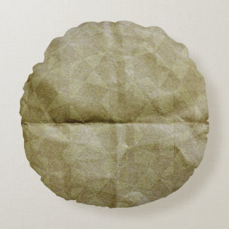 Braune Papierfalte. Mach das Papier kaputt. Hinter Rundes Kissen