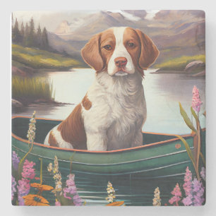 Brittany Spaniel auf einem Paddel: Ein landschaftl Steinuntersetzer