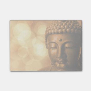 Bronze-Buddha-Statue mit Golden Bokeh-Hintergrund Post-it Klebezettel