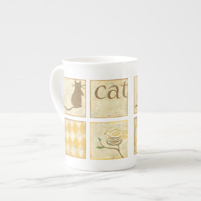Brown Cat and Yellow Bird by Chariklia Zarria Prozellantasse (Vorderseite Links)