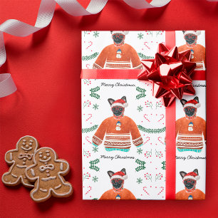 Brüsseler Hund trägt festlichen Weihnachtspullover Geschenkpapier