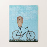 Buff Cocker Spaniel Hund sitzt auf Vintagem Fahrra<br><div class="desc">Puzzle mit einem bezaubernden Cocker Spaniel,  der an einem blauen Sommertag auf einem altmodischen Fahrrad sitzt.</div>