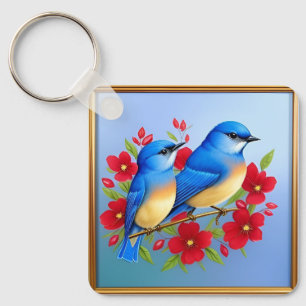 Bunte Blaue Vögel sitzen zwischen roten Blumen Schlüsselanhänger