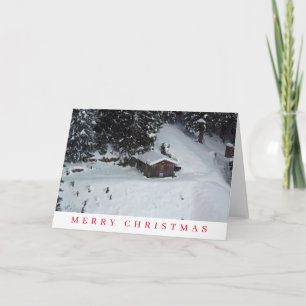 Cabine en bois dans la neige voir la carte de Noël