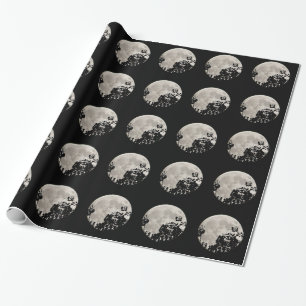 Cadeau Envelopper la lune de papier derrière les feuilles