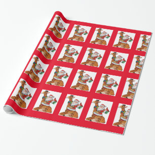 Cadeau Père Noël sur un papier d'enveloppement de Noël en
