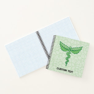 Caduceus mit Blätter Hintergrund Notizbuch