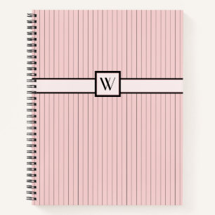 Cahier à spirale rose avec rayures noires
