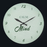 Calm Mind Wellness Große Wanduhr<br><div class="desc">This calming Calm Mind wall clock features a soft mint green background with a subtle woven texture that adds warmth and depth to the design. The dark green typography creates a beautiful natural contrast, giving the clock a peaceful and balanced aesthetic. Inspired by yoga, mindfulness, and wellness interiors, this minimalist...</div>