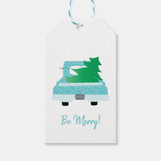 Camion bleu vintage avec étiquette cadeau d'arbre 