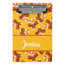 Candy cane wrapped with red bow pattern mini klemmbrett