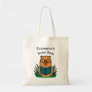 Capybara beim Lesen eines Buches Tragetasche