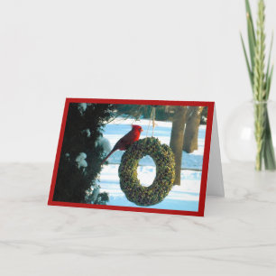Cardinal rouge sur la carte de vacances Wreath